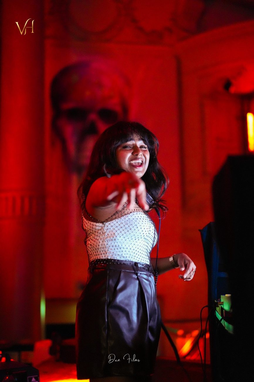 JuLix pointing to the crowd under red light